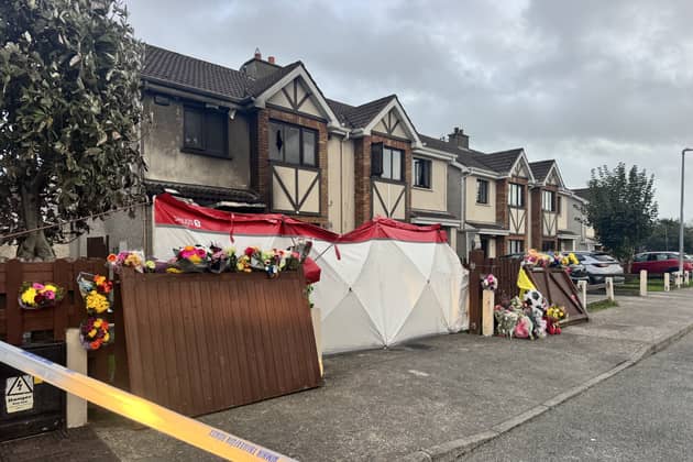 Floral tributes outside a house