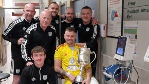 Letterkenny Rovers 'keeper gets his hands on the cup following leg break in final