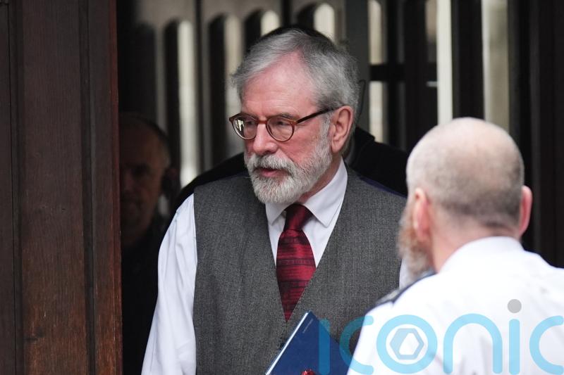 Gerry Adams arrives at High Court for bombings trial